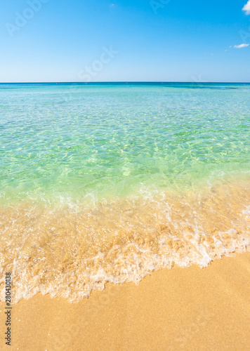 Photography Beautiful sea with turquoise water and golden beach in Salento.