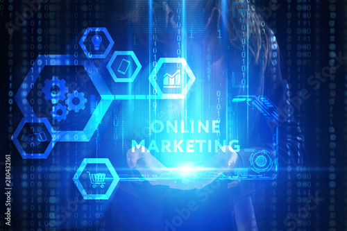 The concept of business, technology, the Internet and the network. A young entrepreneur working on a virtual screen of the future and sees the inscription: Online marketing