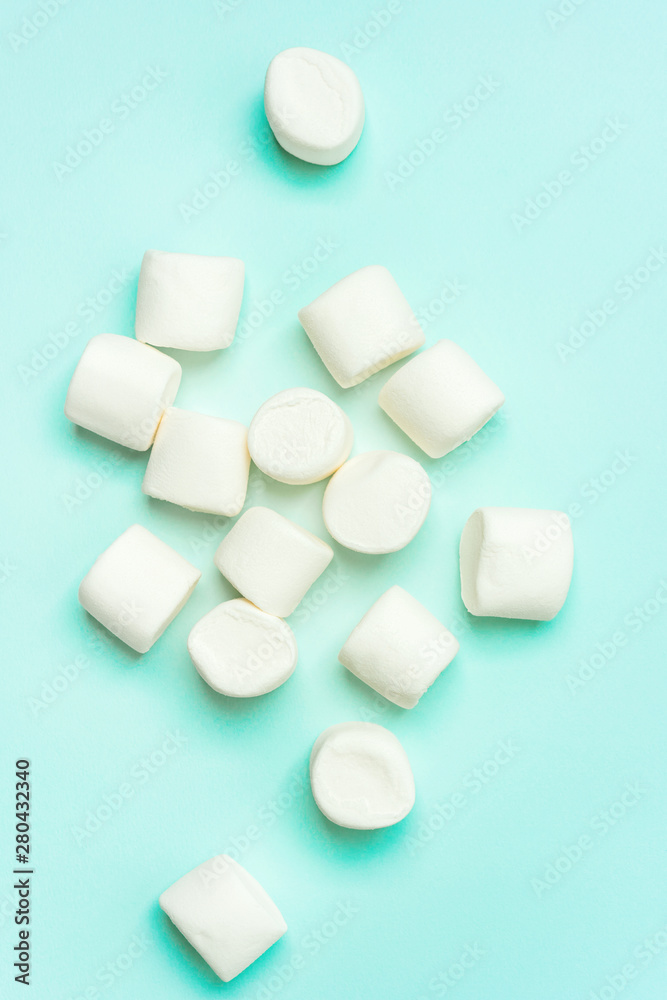 Сlose-up of marshmallow on turquoise background Сlose-up of marshmallow on turquoise background