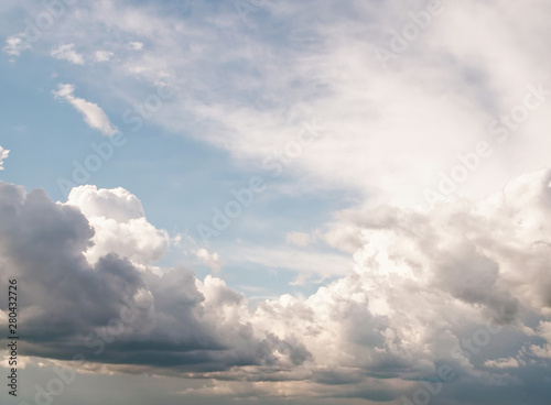 Natural looking afternoon sky with beautiful summer rain cumulus and stratus clouds with copypaste for design background