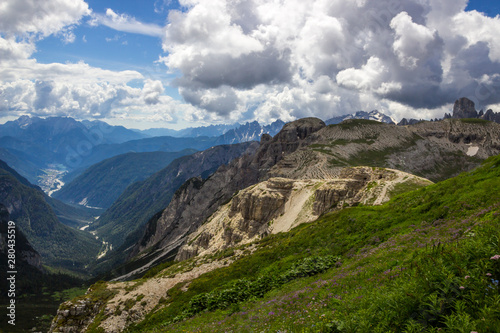 clouds over mountain trail in Dolomites