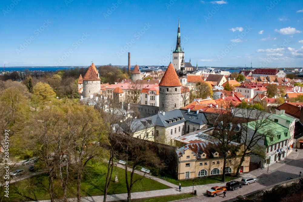 Beautiful scenic aerial view of the Tallinn old town, Estonia with towers and churches, Baltic sea on the background
