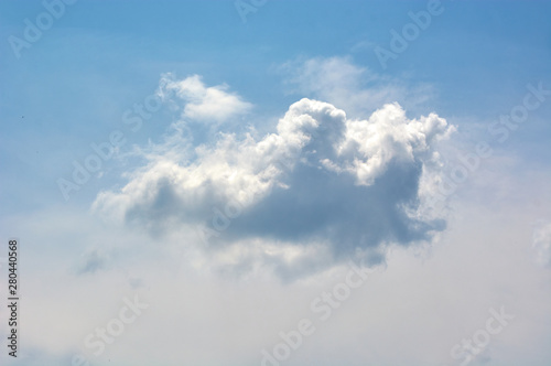 A beautiful, lonely, fluffy cloud in the blue sky
