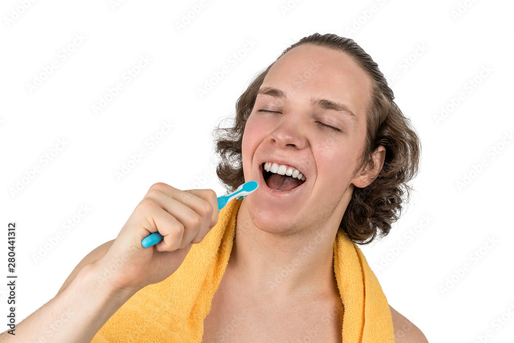 Young happy handsome man singing to toothbrush, isolated on white Young happy handsome man singing to toothbrush, isolated on white