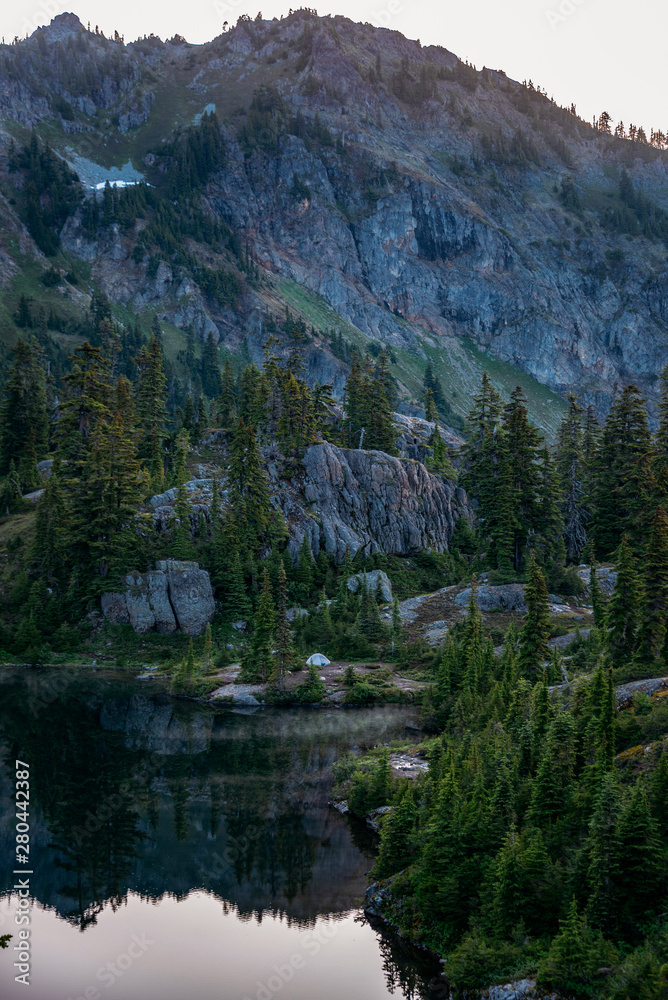 Dramatic sunset view of mountains in the Alpine Lakes Wilderness. Central Cascade Mountain Range, Washington State, July 2019