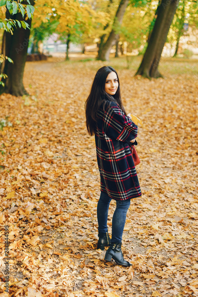 stylish girl exploring the city and park in the autumn stylish girl exploring the city and park in the autumn