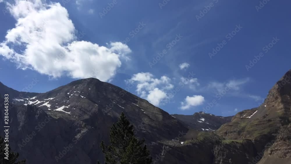 Time lapse of very white clouds in the mountains surrounding the Ibon de Plan Time lapse of very white clouds in the mountains surrounding the Ibon de Plan