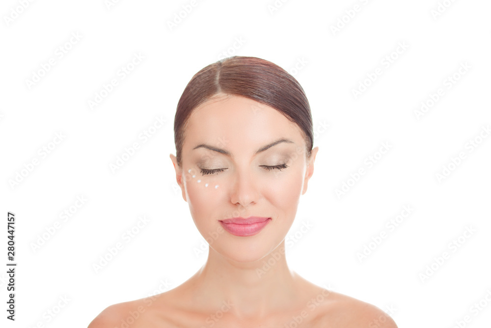 Beauty girl posing with anti wrinkles cream on face Beauty girl posing with anti wrinkles cream on face
