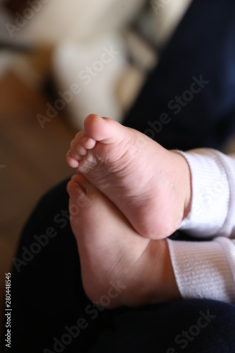 Fototapeta Naklejka Na Ścianę i Meble -  foot baby child kid  feet