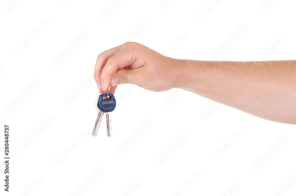 The keys to real estate in the hands of men on a white background The keys to real estate in the hands of men on a white background