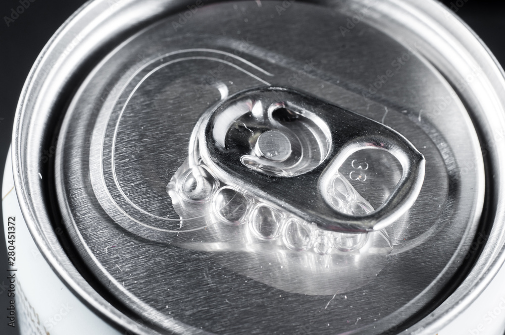 opening of an aluminum beer can close up hissing
