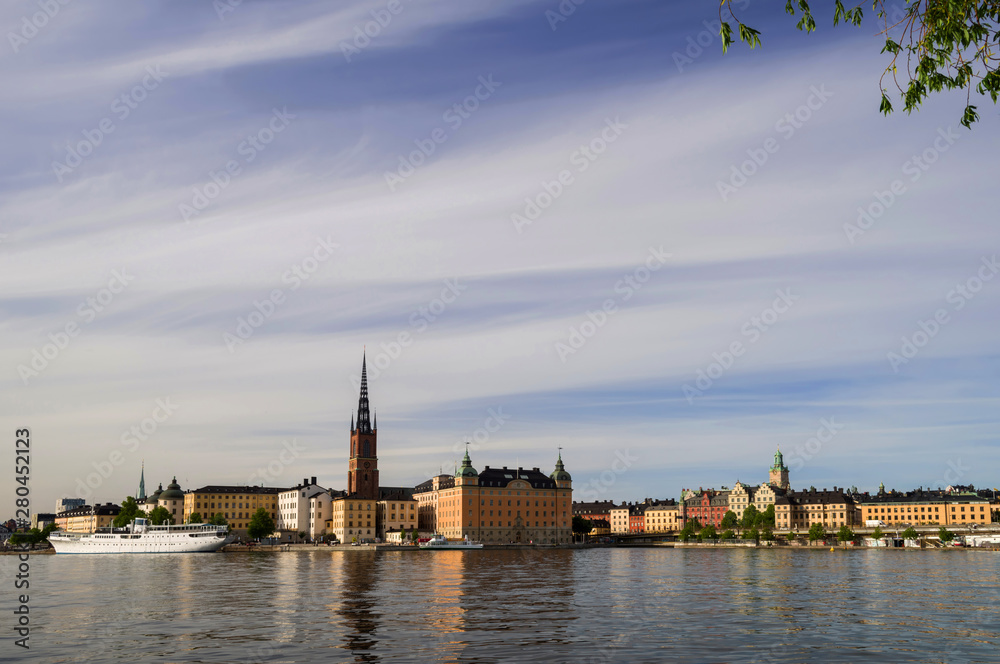Naklejka premium View of Riddarholmen and Gamla Stan from the side of Lake Mälaren. Stockholm, Sweden.