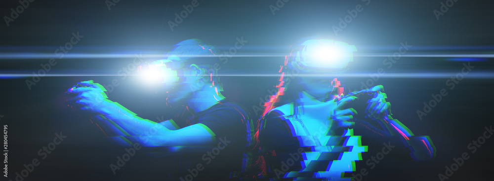 Obraz premium Couple with virtual reality headset are playing game. Image with glitch effect.