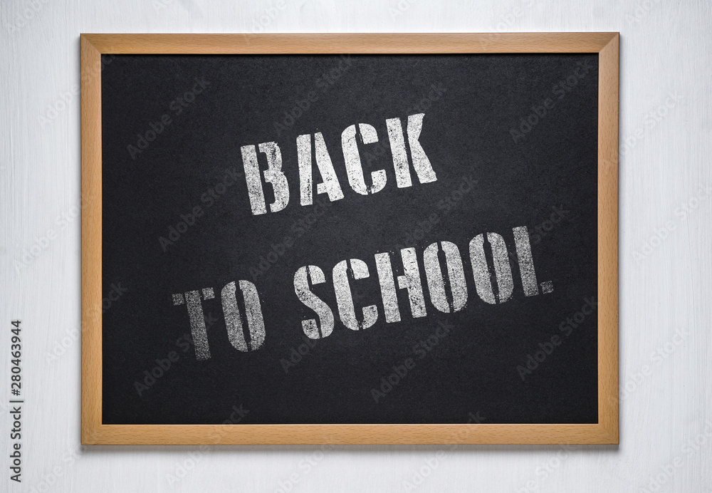 chalk board on a white wooden background. Back to school concept. Back 2 school concept chalk board on a white wooden background. Back to school concept. Back 2 school concept
