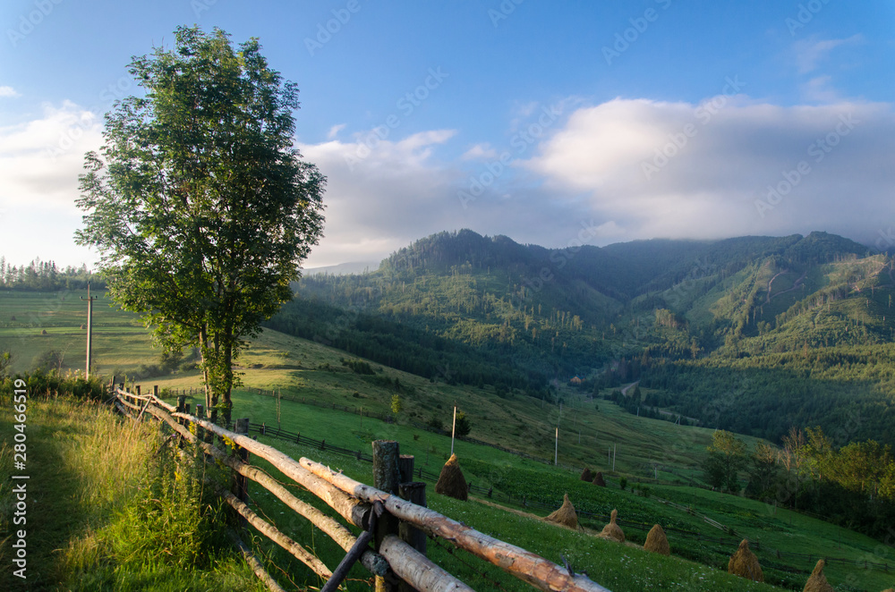 Warm morning in the Carpathians. Morning in the mountains. Mountain valley. Warm morning in the Carpathians. Morning in the mountains. Mountain valley.