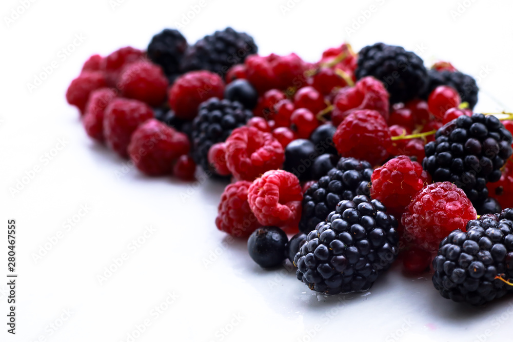 Assortment of ripe berries isolated on white Assortment of ripe berries isolated on white