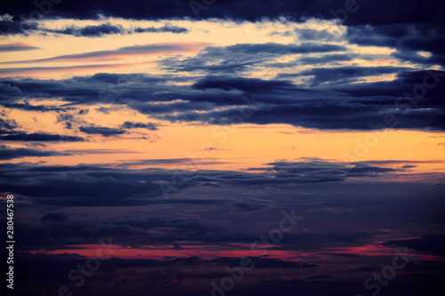 Beautiful sunset - dark sky with clouds and sunlight