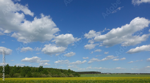 Blue sky and beautiful cloud. Plain landscape background for summer poster. The best view for holiday. © Aleksandr