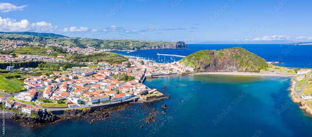 Fort de San Sebastian, idyllic praia (beach) and azure turquoise baia (bay) do Porto Pim, red roofs of historical touristic Horta town centre, Monte (mount) Queimado, Faial island, Azores, Portugal.
