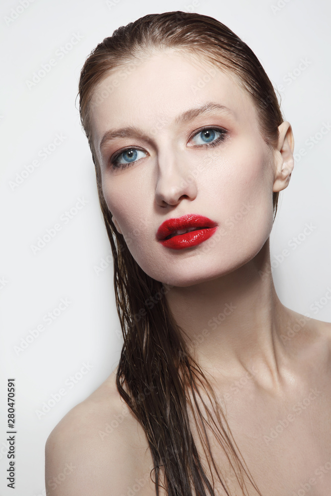 Young beautiful glamorous woman with wet hair and red lips Young beautiful glamorous woman with wet hair and red lips