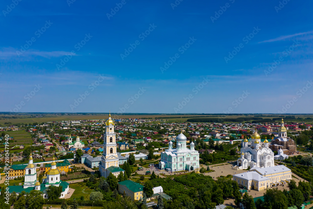 Aerial drone view of Cathedral Square Holy Trinity Seraphim-Diveevo monastery near belfry and Trinity Cathedral in Diveevo