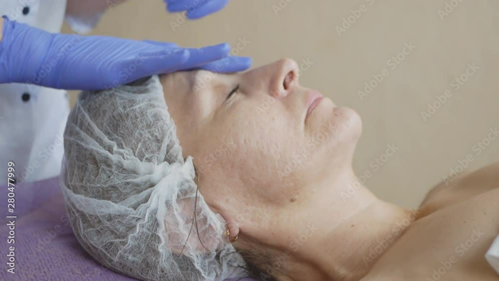 beauty treatments in the spa salon. face cleaning. cosmetic face massage. beauty treatments in the spa salon. face cleaning. cosmetic face massage.