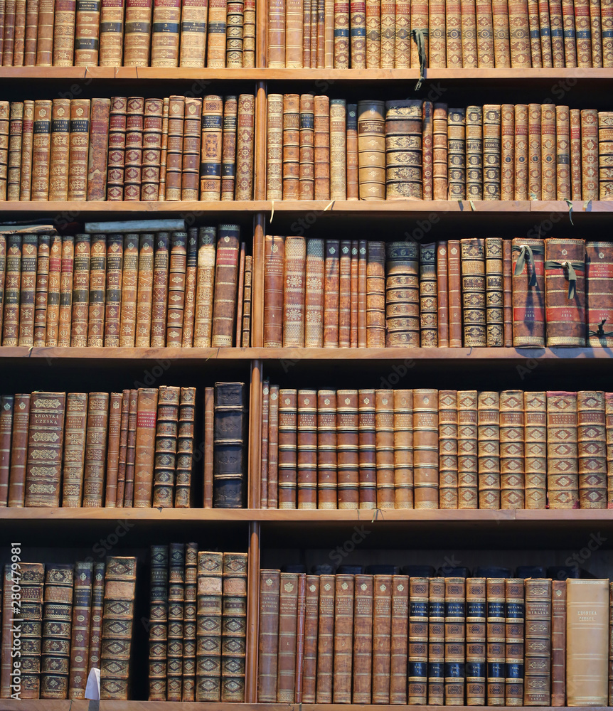 old books on wooden shelf old books on wooden shelf
