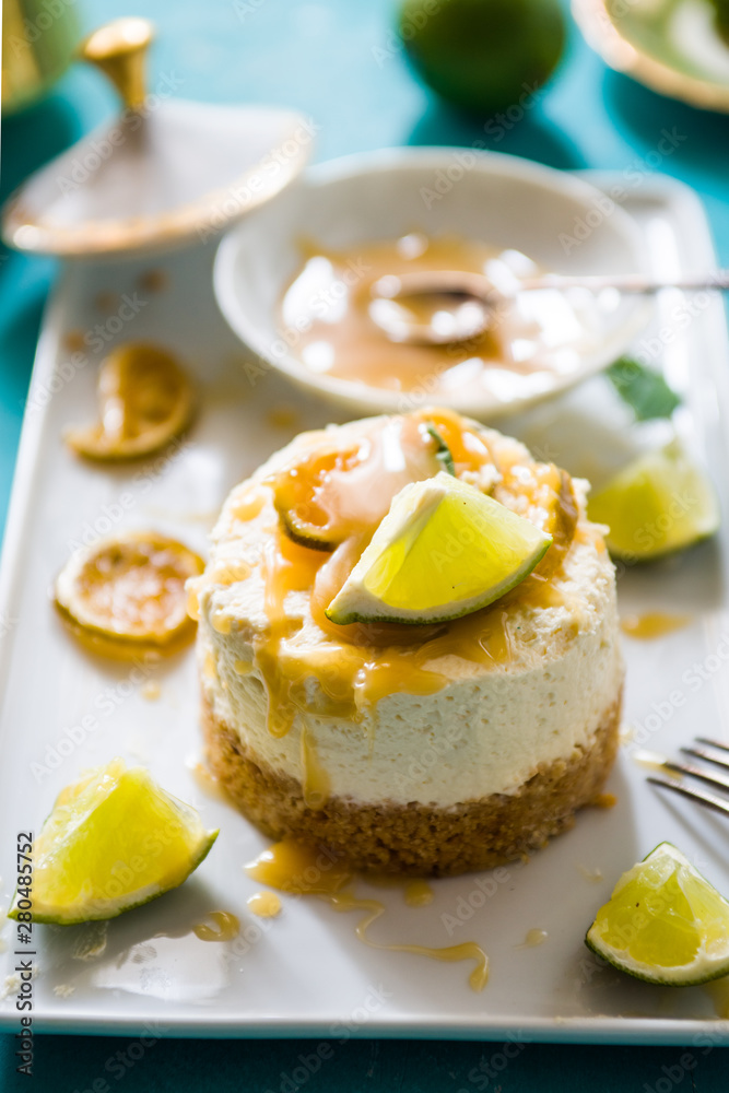 Mojito cheesecake with rum and lime syrup, on a rectangualr plate ,flatlay,topview Mojito cheesecake with rum and lime syrup, on a rectangualr plate ,flatlay,topview