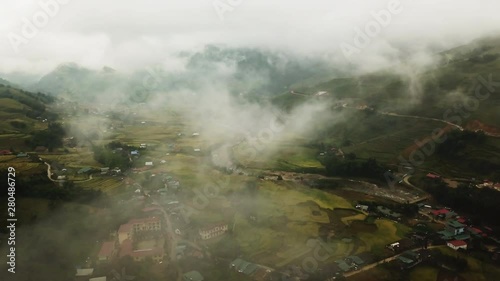 flying through the Bed Of Fog And Clouds Above The Moang Hoa Valley In Sapa, drone dolly in shot photo