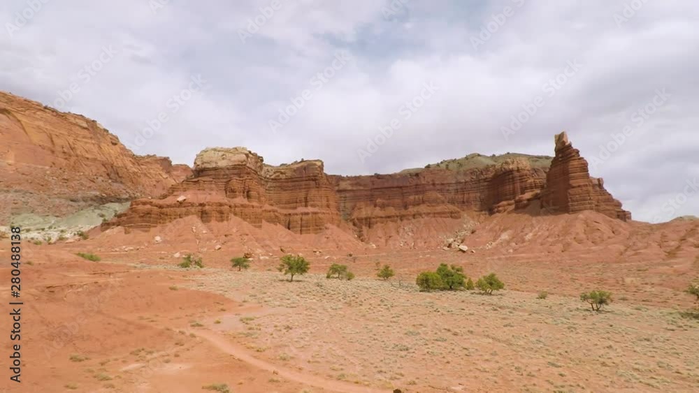 Capitol Reef National Park is characterized by sandstone formations, and canyons, and the carved cliff called Chimney Rock. Capitol Reef National Park is characterized by sandstone formations, and canyons, and the carved cliff called Chimney Rock.