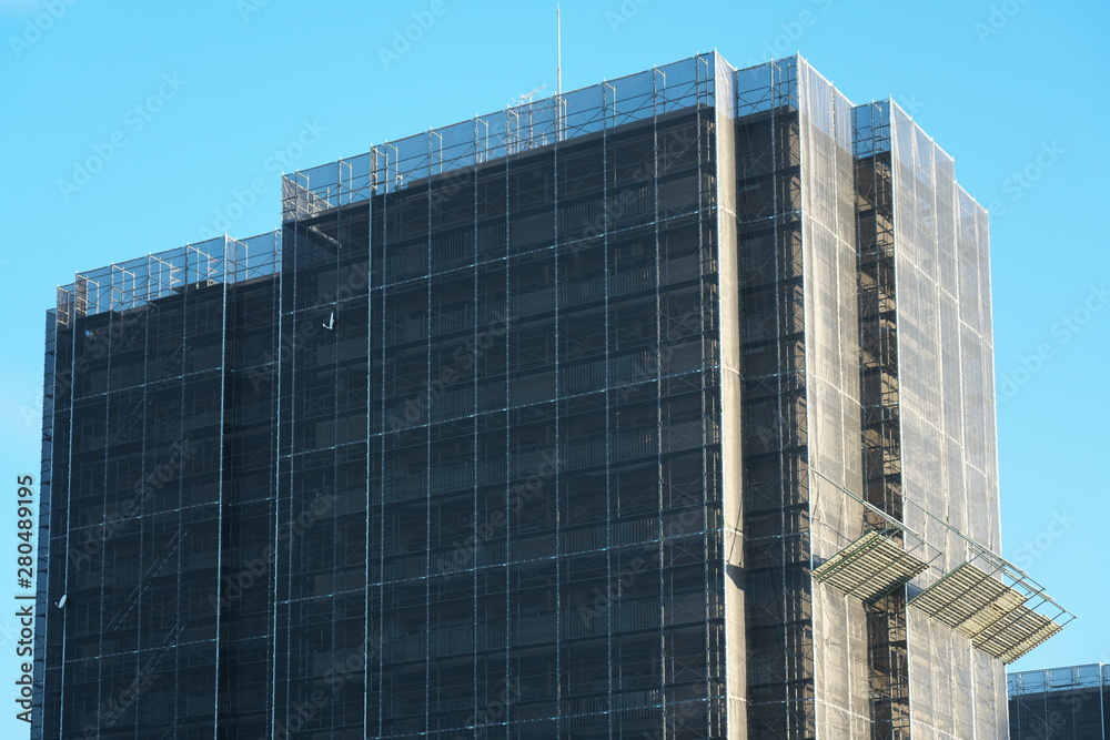 Tokyo,Japan-July 26, 2019: Exterior wall repairing work of an apartment house Tokyo,Japan-July 26, 2019: Exterior wall repairing work of an apartment house