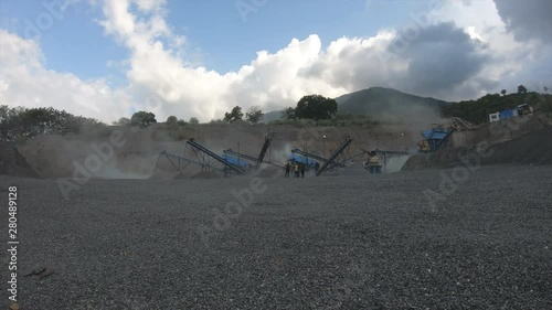 Time Lapse Stone Crusher Footage 4K using Gropro Hero 7 Black 12 second. Location Palu, Central Sulawesi, Indonesia. photo