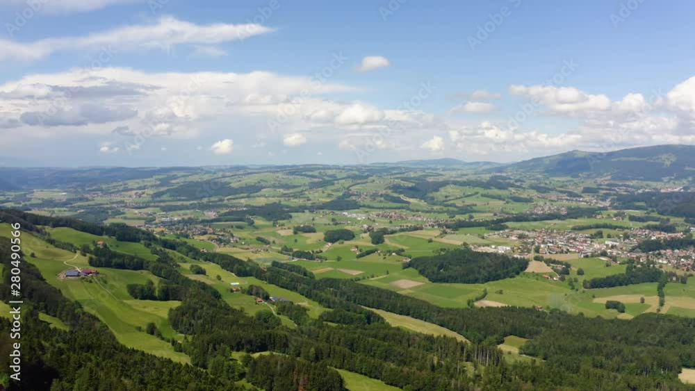 Aerial above forests and farmland on the slopes of Mont Chesau, Vaud Switzerland Aerial above forests and farmland on the slopes of Mont Chesau, Vaud Switzerland