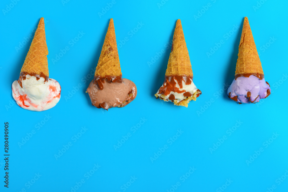 top view mini ice cream cones in a melting process on a blue background