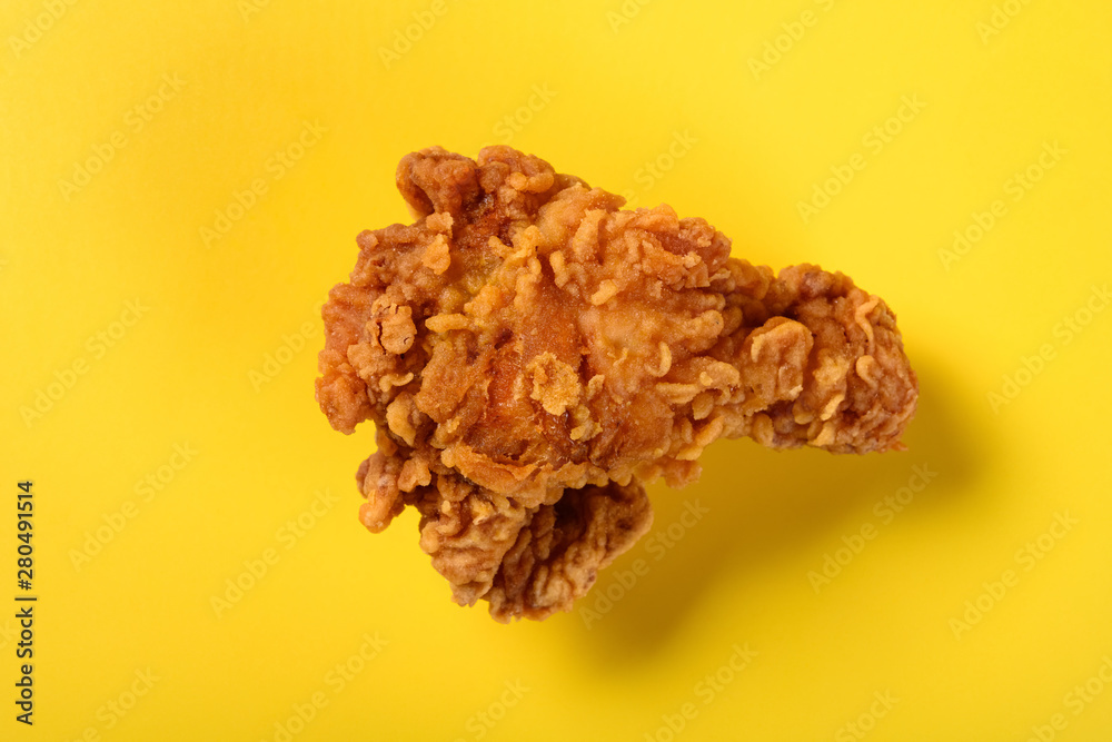 top view fresh deep fried chicken drumstick on yellow background top view fresh deep fried chicken drumstick on yellow background