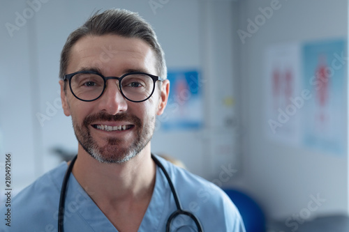 Male surgeon looking at camera in hospital photo
