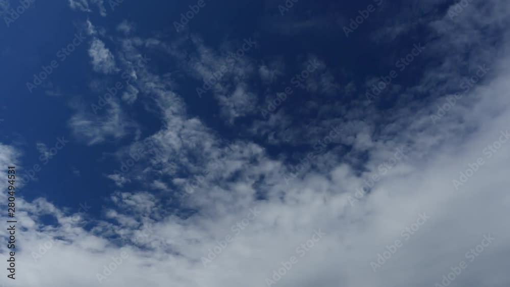 Fluffy white clouds blue sky time lapse motion background. Bright blue sky fluffy white cloud cloudscape cloudy heaven. Fluffy white clouds blue sky time lapse motion background. Bright blue sky fluffy white cloud cloudscape cloudy heaven.