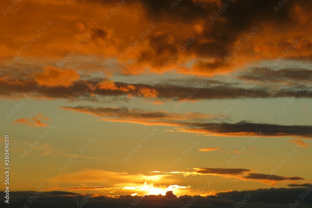 Beautiful orange golden sunset background over the city