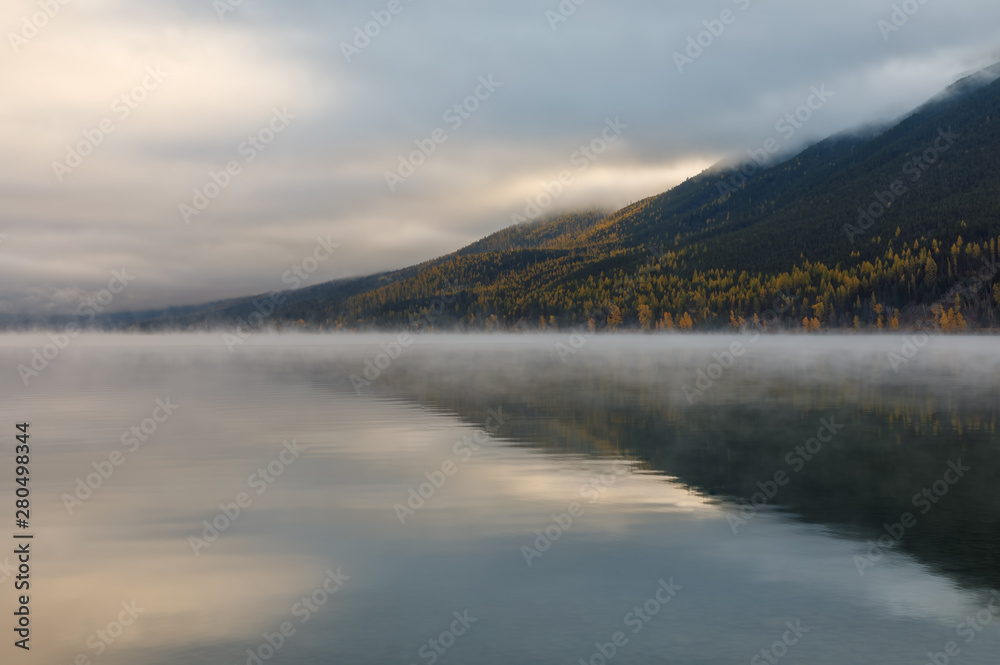 Lake McDonald, Glacier National Park, Montana in autumn on a peaceful cloudy day
