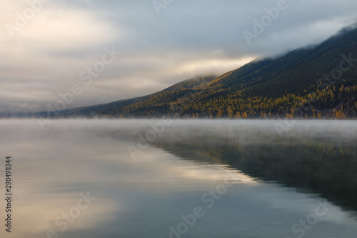 Lake McDonald, Glacier National Park, Montana in autumn on a peaceful cloudy day