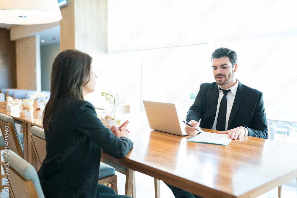 Businessman Interviewing Professional In Hotel Businessman Interviewing Professional In Hotel