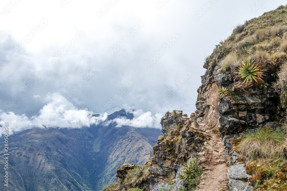 Narrow path on the hiking trail at high altitude Peruvian mountains between Maizal and Yanama, Peru