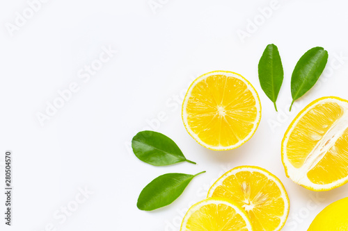 Lemon and slices with leaves isolated on white.