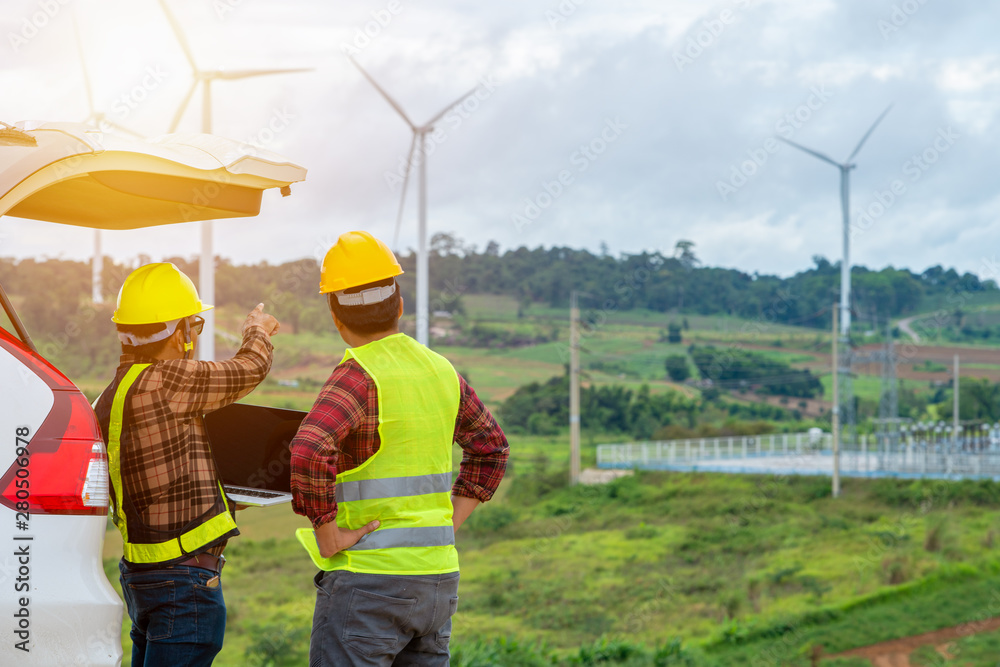 Two Engineering checking the wind turbine production energy electric Two Engineering checking the wind turbine production energy electric