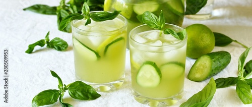 cold drink with basil, cucumber and lime. Mojito, lemonade with basil.