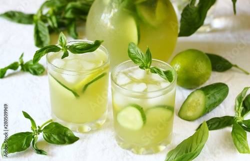 cold drink with basil, cucumber and lime. Mojito, lemonade with basil.