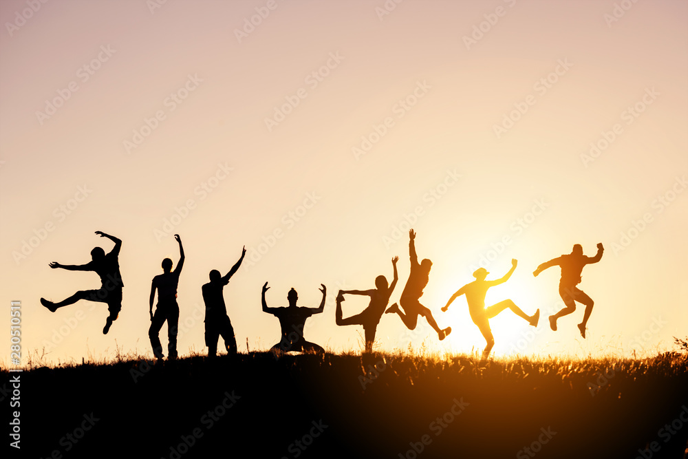 Silhouettes of big group of friends jump and fun Silhouettes of big group of friends jump and fun