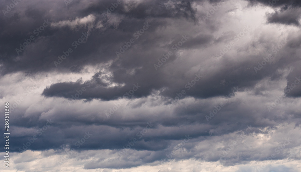 Dramatic thunder clouds in the sky.