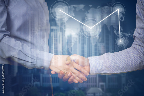 handshake business partners with virtual map link and business building.