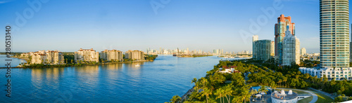 Panoramic high view of South Beach pier at Miami South Pointe Park with residential houses and a blue sunny summer sky, Florida, USA. Downtown Miami in the southern spot of world famous South Beach.
